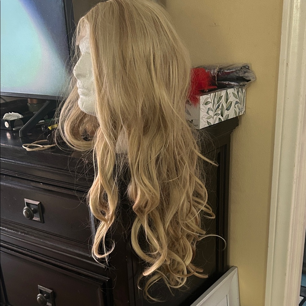 Blonde Wig. Big curls. Feels soft. Adjustable for the perfect fit.